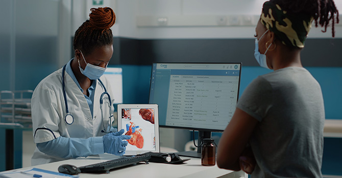 doctor discusses health with black woman