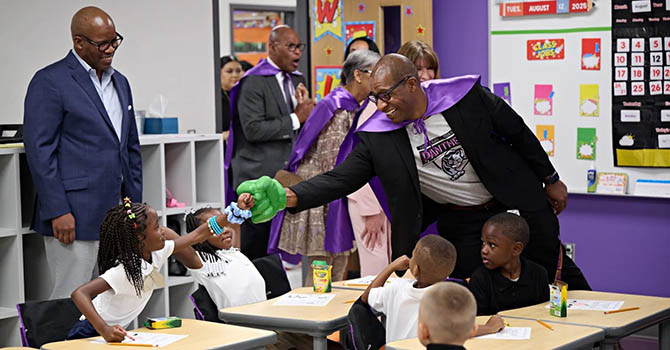 Albert C. Black Jr. is greeted by students